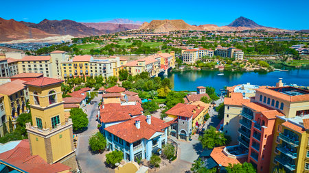 Aerial Vibrant Mediterranean Resort Town by Lake Las Vegas with Desert Mountainsの写真素材