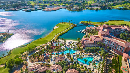 Aerial Luxury Lakeside Resort with Pools and Golf Course Fly Overの写真素材