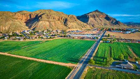 Aerial Farmland and Small Town with Red Rock Mountains in Utahの写真素材