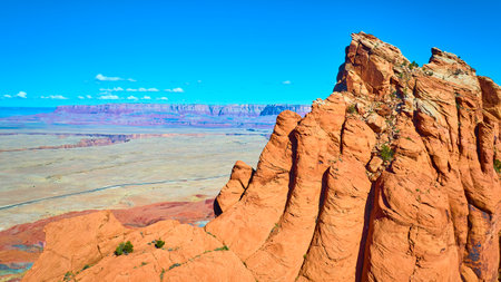 Aerial Fly Over Red Sandstone Cliffs and Desert at Marble Canyonの写真素材