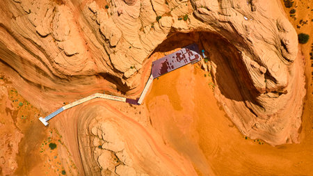 Aerial Red Rock Canyon Walkway with Striated Sandstone Formations Top Down View