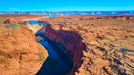 Aerial Glen Canyon Dam Colorado River and Lake Powell Fly Overの写真素材