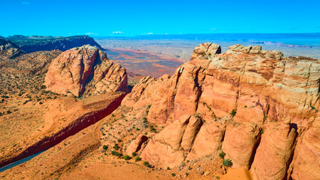 Aerial Vermilion Cliffs and Marble Canyon Sunlit Sandstone Formations Fly Overの写真素材