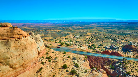 Aerial Fly Over Sandstone Cliff Desert Plain and Winding Road Marble Canyon