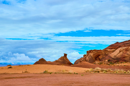 Red Sandstone Formations and Dramatic Sky in Desert Amphitheater Low Perspectiveの写真素材