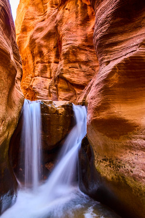 Waterfall Flowing Through Kanarra Slot Canyon Vertical Low Angle Viewの写真素材