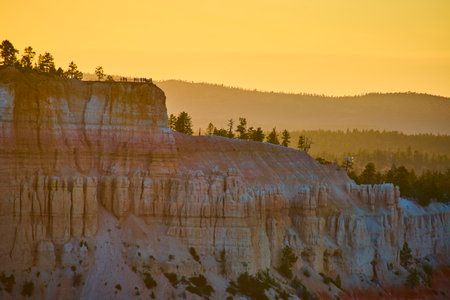 Bryce Canyon National Park Cliffs Pine Trees and Visitors at Sunset Golden Hourの写真素材