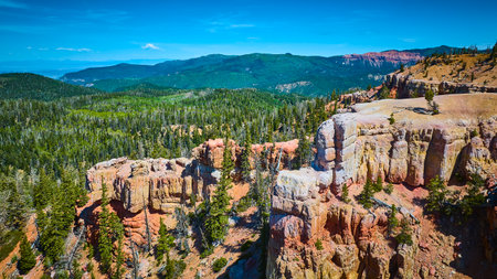 Aerial Rugged Rock Formations Pine Forest and Mountain Landscape Utahの写真素材