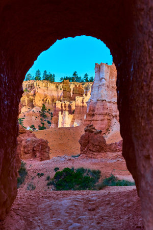 Bryce Canyon Tunnel Framing Hoodoos and Trail with Blue Sky Utah Landscapeの写真素材