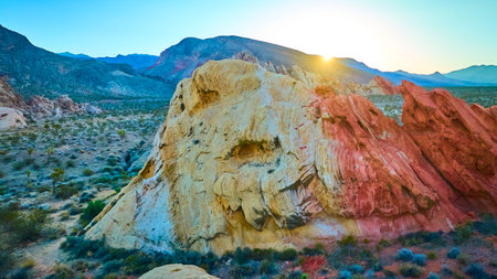 Aerial Sunlit Red and White Rock Formations in Nevada Desert at Golden Hourの写真素材