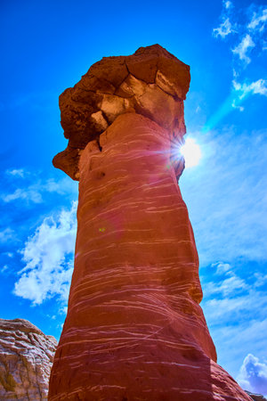 Red Sandstone Hoodoo with Sunburst Toadstool Hoodoos Utah Blue Sky