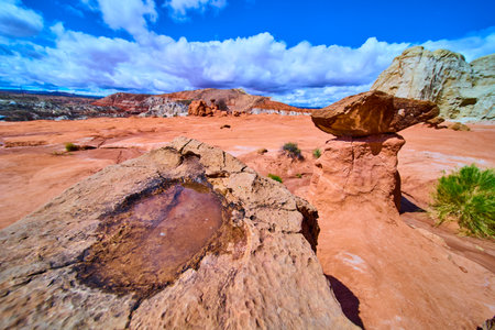 Balanced Rock Hoodoo with Desert Pool and Distant Mesa Kanab Utahの写真素材
