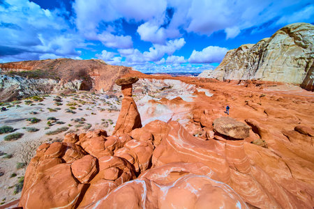 Sandstone Hoodoo and Hiker at Paria Rimrocks Toadstool Hoodoos Utah Desertの写真素材