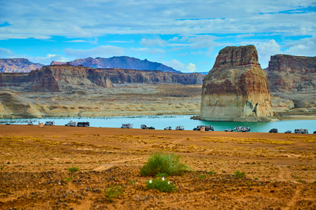 Lone Rock and RVs on Sandy Shore at Lake Powell Utah Desert Landscapeの写真素材