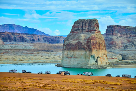 Lone Rock Monolith and RV Campers by Lake Powell Desert Shorelineの写真素材