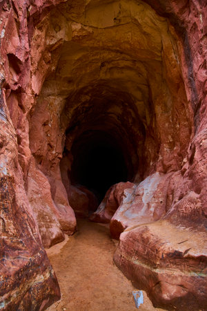 Sandstone Cave Entrance with Graffiti and Shadows Belly of the Dragon Utahの写真素材