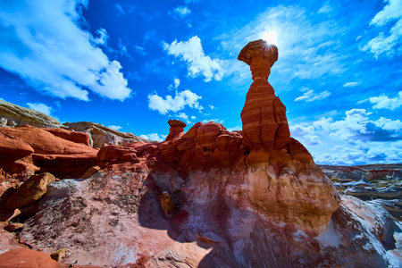 Toadstool Hoodoo and Red Sandstone Formations with Sunburst in Utah Desertの写真素材