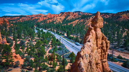 Aerial Red Canyon Hoodoo Pine Forest and Highway in Utah