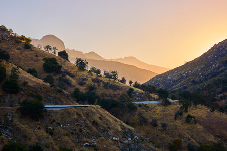 Winding Mountain Road and Sunrise Over Hills in Sequoia National Park