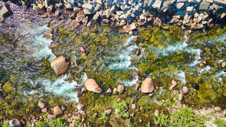 Aerial Merced River Flowing Over Boulders and Stone Embankment Top Downの写真素材