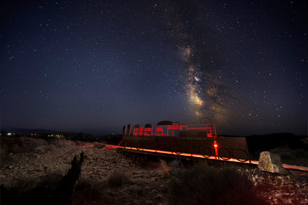 Milky Way Over Mining Train with Light Painting in Nevada Desert Night