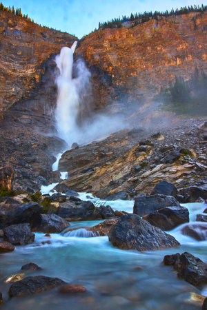 Takakkaw Falls Powerful Cascade Waterfall and Rugged Mountain Landscapeの写真素材