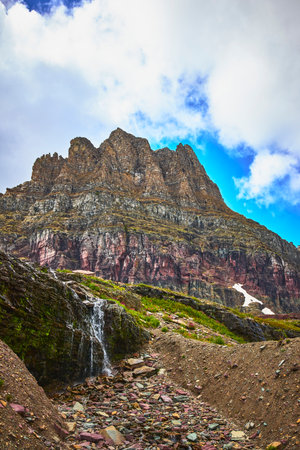 Majestic Rocky Mountain Waterfall and Alpine Scenery on Hidden Lake Trailの写真素材