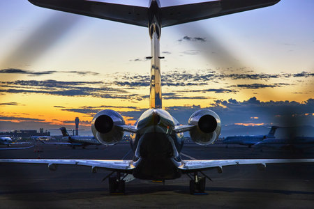 Private Jet at Las Vegas Airport Sunrise Golden Hour with Control Towerの写真素材