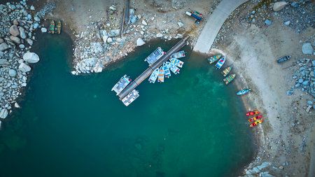 Aerial Lake Sabrina Dock Colorful Boats and Rocky Shoreline Top Downの写真素材