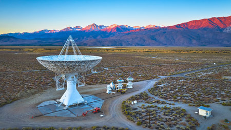 Aerial Owens Valley Radio Observatory Array with Snowy Mountain Sunrise Californiaの写真素材