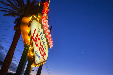 Welcome Sign Las Vegas Nevada Palm Tree at Twilight with Deep Blue Skyの写真素材