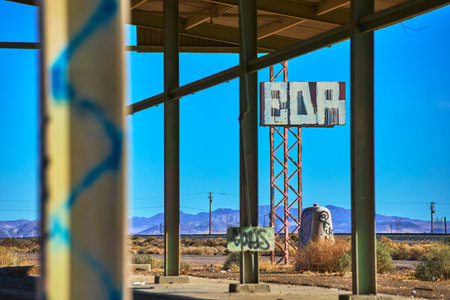 Abandoned Desert Structure With Faded Sign and Graffiti in Yermo California