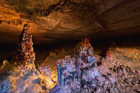 Colorful Graffiti Covered Stalagmites Inside Cowboy Canyon Cave Nevada