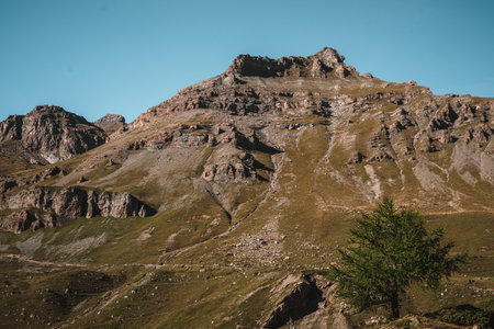 Majestic mountains in the Alps covered with trees and cloudsの写真素材