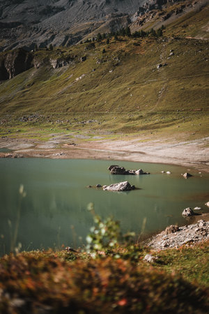 Spectacular lake in the Alps during autumnの写真素材