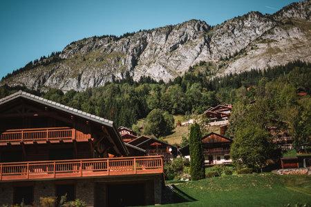 Wooden hut in the alps with mountains in the background Panorama
