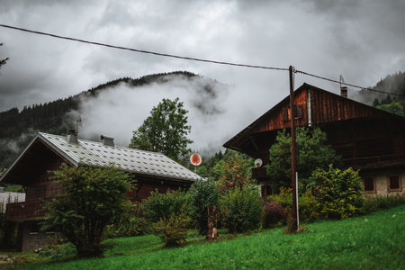 Wooden hut in the alps with mountains in the background Panoramaのeditorial素材