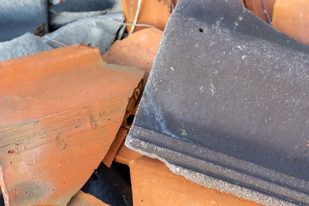 broken tiles of black and orange color close-up
