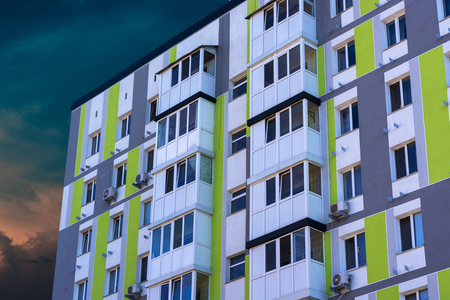 Multistorey apartment house on a blue cloud heavenの写真素材
