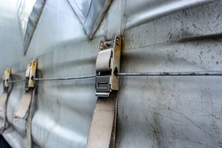 attaching the awning of the cargo trailer closeupの写真素材