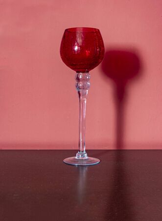 glass with a red bowl on the table closeupの写真素材