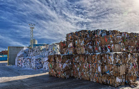 Sweden, Orebro, 24.02.2020: Paper garbage at the recycling plant, large square bales of paper. paper recycling. paper factoryのeditorial素材