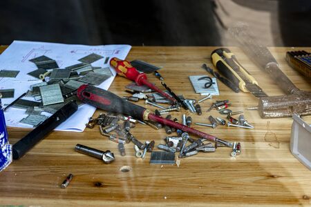 desktop in the workshop, tools lie on the table in the workshop