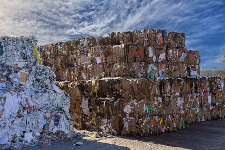 Bales of cardboard and box board. Waste paper for Recycling. Background of paper textures, Paper garbage at the recycling plantの写真素材