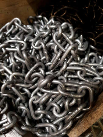 galvanized chain lies in a drawer, selling chain shopの写真素材