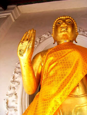Golden Buddha statue is in the temple.