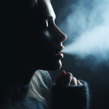 Woman blowing steam from behind her mouthの素材