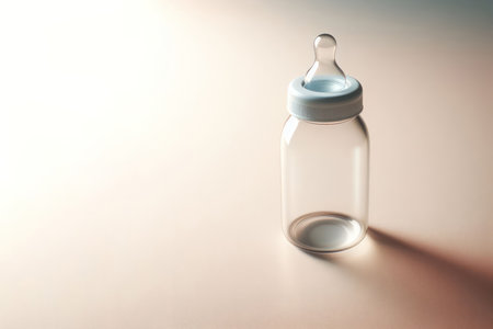 Baby bottle with pacifier on clean background. Space for textの素材