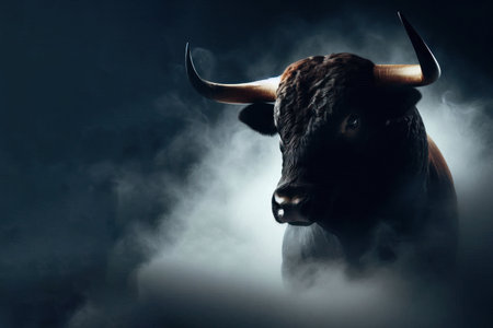 Close-up of a bull in smoke on a dark background. Space for textの素材