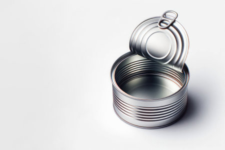 An open empty tin can on a light background. Space for textの素材